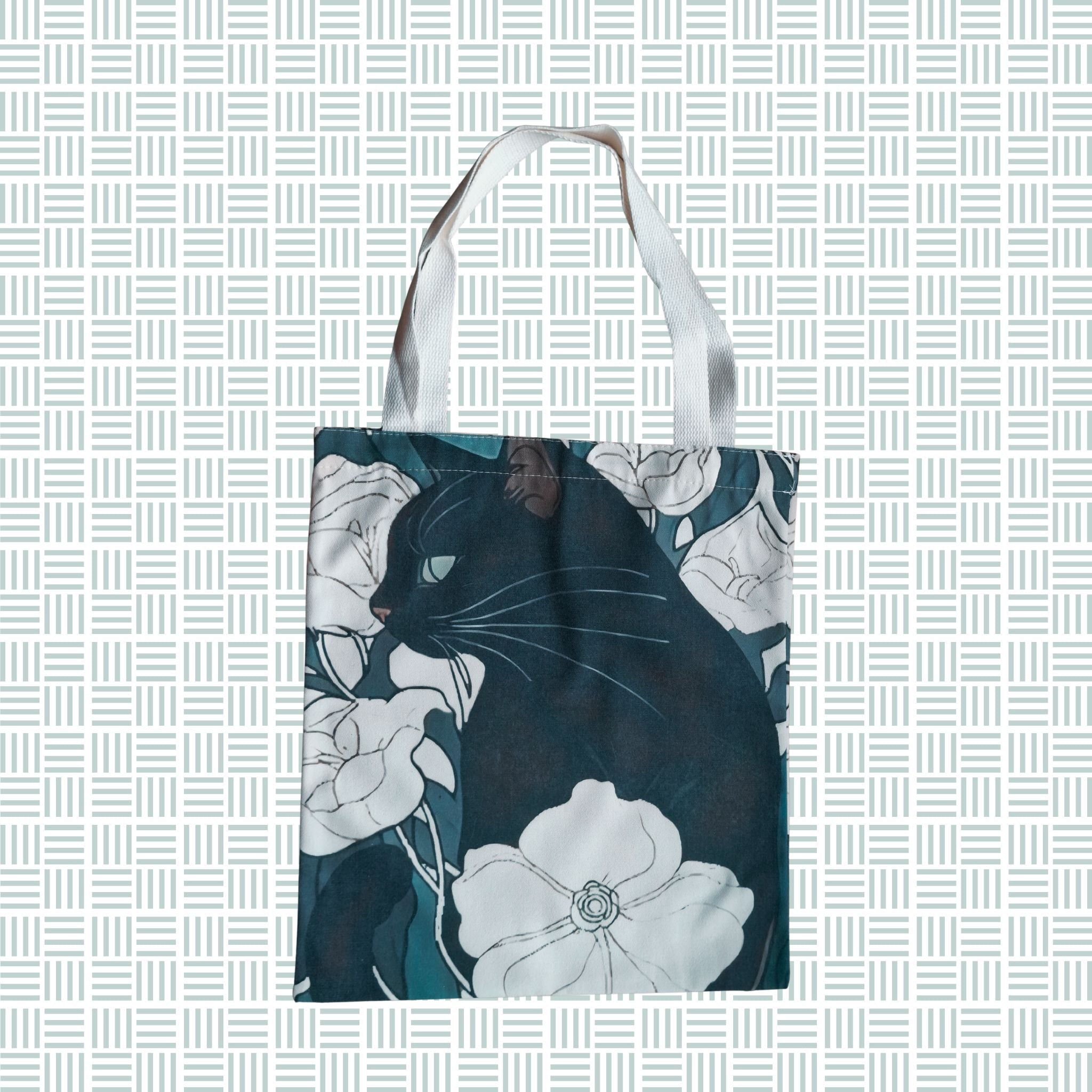the moody cat floral tote bag